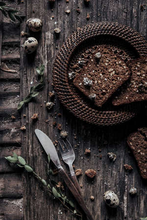 home made bread with bran on a wooden table style rusticの写真素材