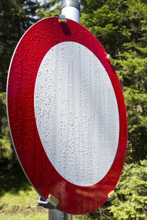 Road sign carriage drive at early morning with dew drops an sun beams.の写真素材