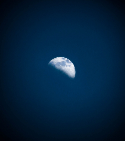 Our Beautiful Moon in Blue black backgroundの写真素材