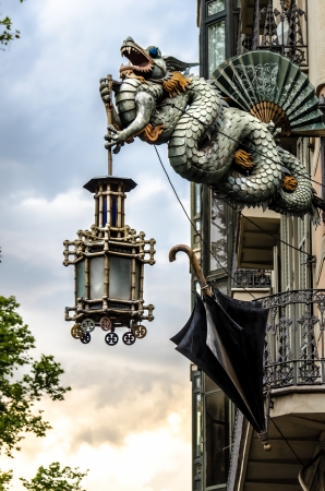 a beautiful design of a lantern is hanging of a small dragonの写真素材