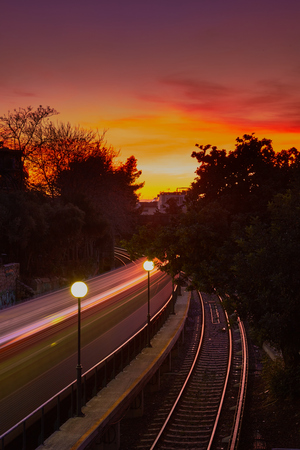 Light trails from a train in the beautiful cityscape sunset