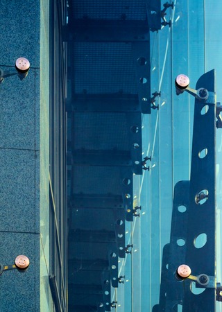 Glass curtain walls. Fasteners Elements of spider glass system. Facade detailの写真素材