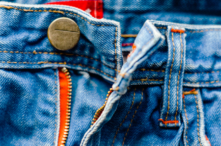 Detail of jeans trousers close-up. Pockets, pants, belt loops, thick stitches. Elements of denim pants backgroundの写真素材
