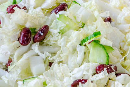 Homemade Vegetable salad with red beams backgroundの写真素材