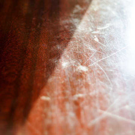 Scratched wooden table. Red wood and black striped texture backgroundの写真素材