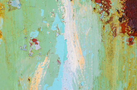 Yellow paint smears on a metal surface. Old metal texture for background