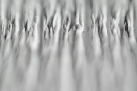 White texture of embossed paper. Macro. Shallow depth of field. Abstract background with deep grooves in the texture of corrugated paperの写真素材