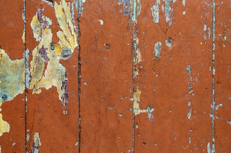 Texture of old dilapidated wooden floor with brown peeling paint. Exfoliated Paint on an Old Wooden Floor. Shabby Backgroundの写真素材