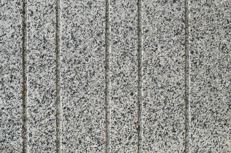 Gray Granite Texture with Parallel Decorative Grooves. Natural Stone as a Wall Finishing Materialの写真素材