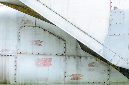 Old aircraft fuselage close up. Door handle and rivets.の写真素材