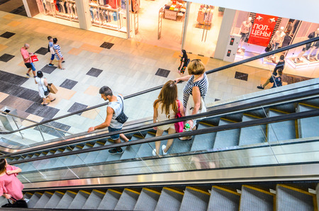 People on Escalator Motion Blurred, Top View. Abstract Blur Background of Moving Staircase