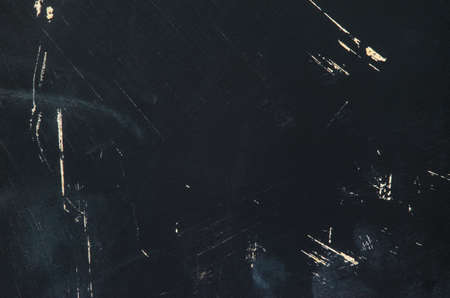Black texture of the painted board with scratches. Black blackboard slate with nothing on it. Blank...