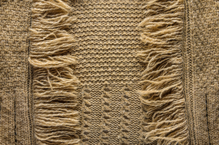 Knit Cloth with Fringe Background. Beige Knit Sweater Blank Backdropの写真素材