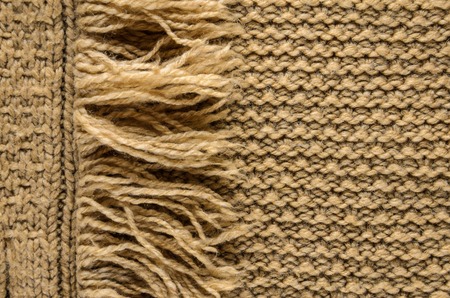 Knit Cloth with Fringe Background. Beige Knit Sweater Blank Backdropの写真素材