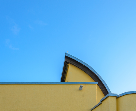 Element of the original building against a clear blue sky. Architectural backgroundの写真素材