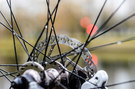 Front Hub of a Mountain Bike Close-Up. Bicycle Disc Brake Rotorの写真素材