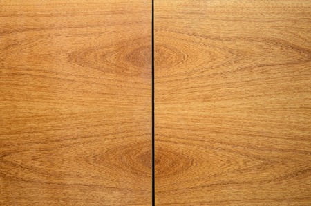 Book-Matched Wood Panels Background. Joints of Decorative Finishing from Wood Panels on Interior, Exterior Walls or Kitchen Facades. Mirror Matching Pattern of Two Wood Wallboardsの写真素材