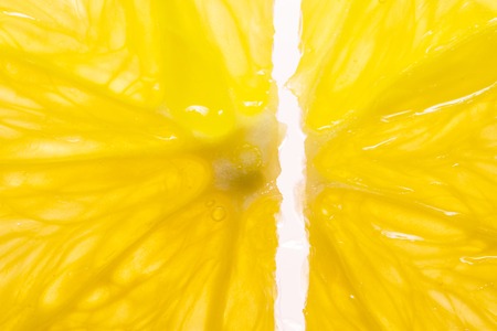 Orange Slices on White background. Shining Through. Macro Image of Ripe Orange for Background.の写真素材