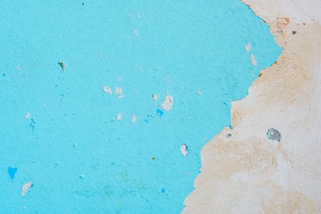 Peeling Blue Aquamarine Color Paint from the Wall. Shattered Plaster Backgroundの写真素材
