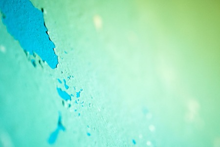 Peeling Blue Aquamarine Color Paint from the Wall. Shattered Plaster Backgroundの写真素材