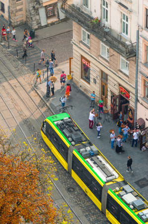 Lviv, Ukraine- September 1, 2018: Market Square. Foggy Morning of the City Center from Town Hall Tower. View from Above of the Tram Tracks with Yellow Tramのeditorial素材