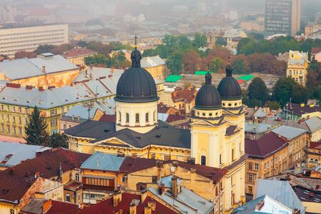 Lviv, Ukraine- September 1, 2018: Church of Transfiguration. Foggy Morning of the City Center from Town Hall Tower. Roofs of the Old Cityのeditorial素材