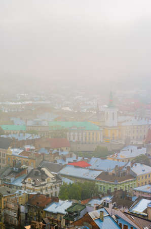Lviv, Ukraine- September 1, 2018: Foggy Morning of the City Center from Town Hall Tower. Tiled Roofs of the Old City. View of the Cafe House of Legends and Museum of Sculpture I. G. Pinzel.のeditorial素材