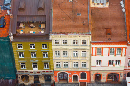 Lviv, Ukraine- September 1, 2018: Foggy Morning of the City Center from Town Hall Tower. Tiled Roofs...