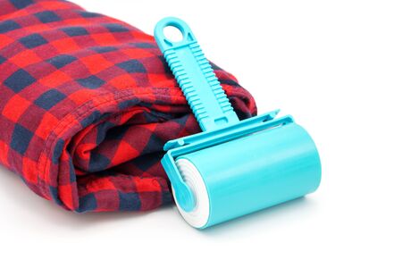 Sticky washable roller for cleaning clothes from animal hair and the pellet. Cleaning clothes and furniture from dust, wool, hairの写真素材