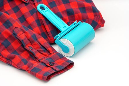 Sticky washable roller for cleaning clothes from animal hair and the pellet. Cleaning clothes and furniture from dust, wool, hairの写真素材