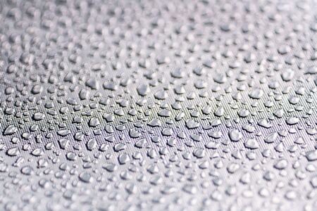 Silver Reflective Fabric Material Texture with Imitation of Water Droplets . Abstract Background of a Reflector Fabric for Lighting Equipment.の写真素材