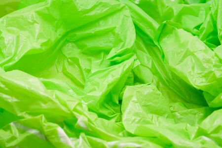 Green Plastic Bag Texture. Abstract Wrinkled Background of Plastic Garbageの写真素材