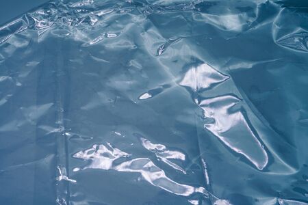 Blue Plastic Bag Texture. Abstract Wrinkled Background of Plastic Garbageの写真素材
