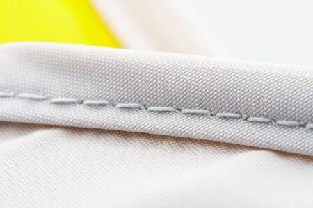Finishing seam of a sports backpack close-up shot. Sport nylon fabric textureの写真素材
