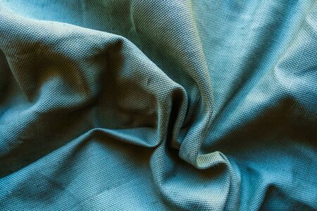 Blue linen cloth texture. Natural fabric material backgroundの写真素材