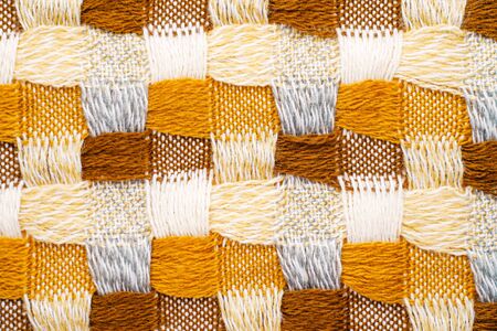 Knitwear Fabric Texture of Blanket with a Complex Square Interweavingの写真素材