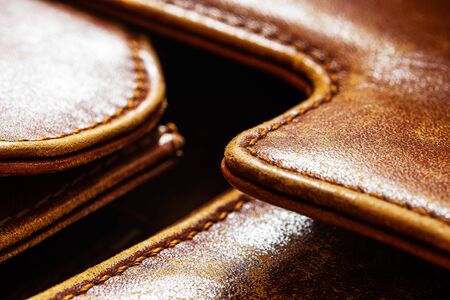 Detail of an old leather bag briefcase close upの写真素材