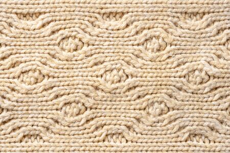 Beige Knitwear Fabric Texture with Pigtails. Beige Knitted Background.の写真素材