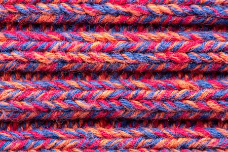 Knitted sweater texture. Pink melange pattern. Background. Copy space