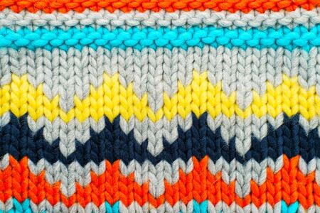 Handmade knitted multi-colored pattern. Hobby background