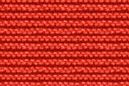 Red Knitwear Fabric Texture. Machine Knitting Texture Macro Snapshot. Knitted Background.