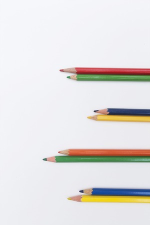 a pair of pencils of red, green, yellow and blue colorsの写真素材
