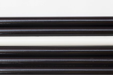 black and white pencils are on each otherの写真素材
