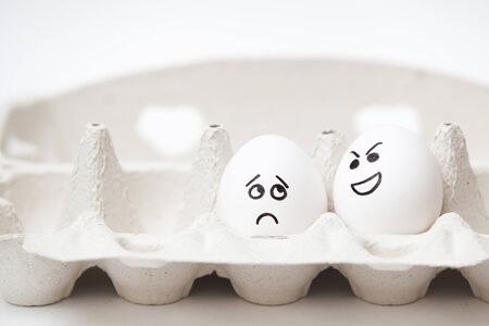 one is afraid the other egg in a boxの写真素材