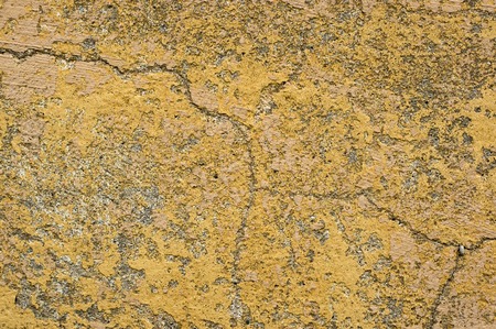 Plastered walls with peeling paint yellowの写真素材