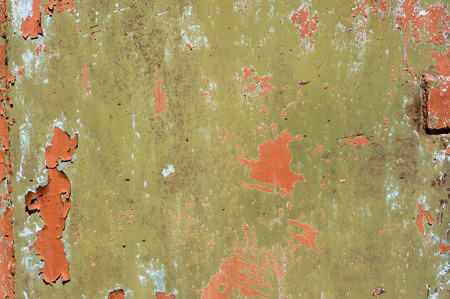 Multicolored peeling wall texture and background. Surface with stains.