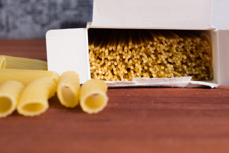 Variety of types and shapes of Italian pasta. Dry pasta background. top view. Diet and food conceptの写真素材