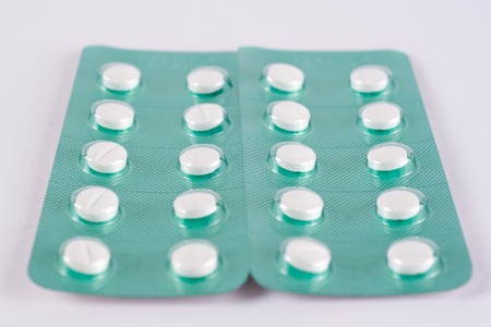 Different medicines. Tablets, pills in blister pack. Medications drugs. Pills over a white background. Medicament treatment. Health care photo.の写真素材