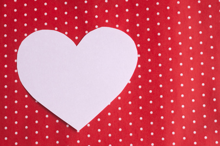 white hearts carved from paper on a red background. Valentine's Day greeting cardの写真素材