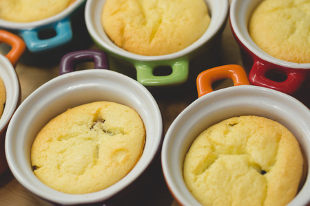 Cottage cheese casserole in colored ceramic forms in the form of pans. kid's foodの写真素材